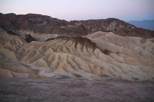 The night falling on the rock formations of the Death Valley desert in California