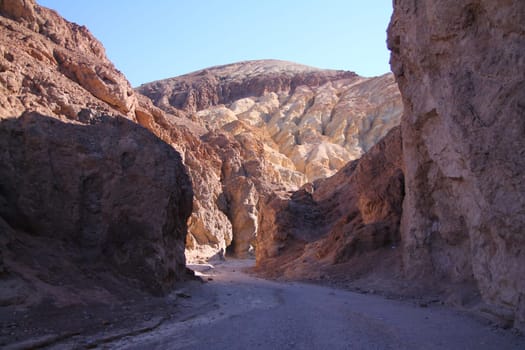 The shadows in the hot colored canyon in the Death Valley desert in California
