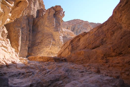 The shadows in the hot colored canyon in the Death Valley desert in California