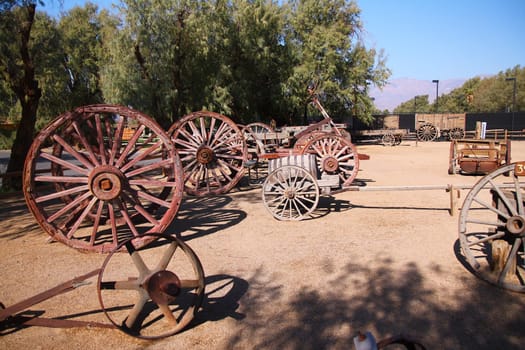 The wooden wheels of the traditional carriages in the desert in California