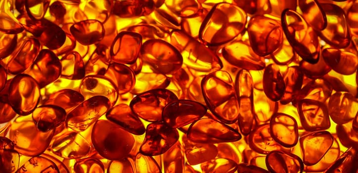 Amber in its natural form and warm color. Amber is often made into jewelry.