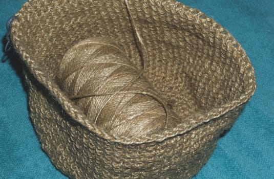 Jute needlework. handmade knitted basket