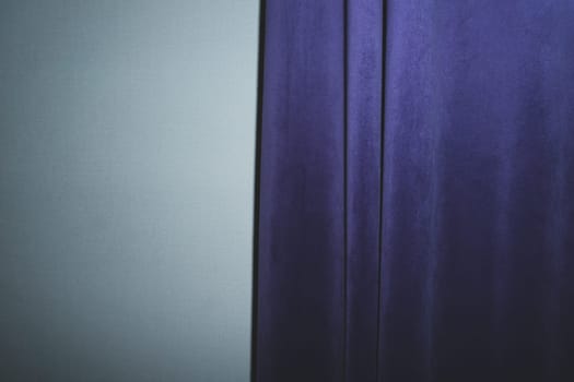 Curtain on the wall. violet drapery