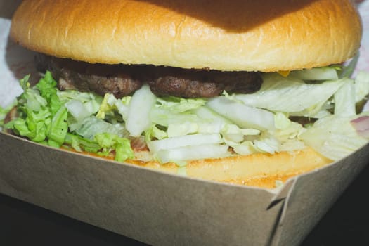 Burger in cardboard box close up