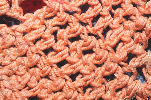 Knitted background. weaving threads. fabric close up