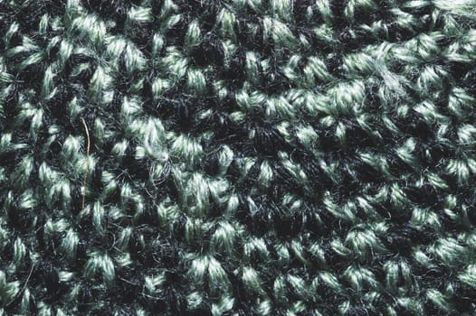 Knitted background. woolen fabric close up