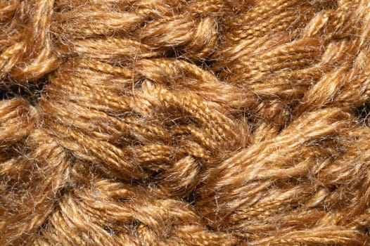 Knitted woolen background close up. brown soft fabric