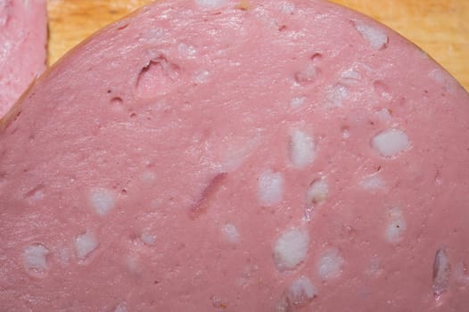 Boiled sausage slice close up background