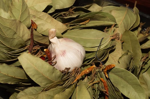 Garlic and bay leaves. dried hot peppers close up