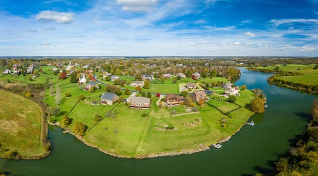 Aerial footage of residential subdivision by a lake in Central Kentucky in fall