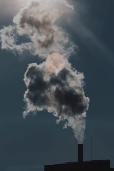 Air pollution from power plant chimneys. Industry and global warming concept