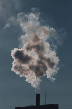 Air pollution from power plant chimneys. Industry and global warming concept