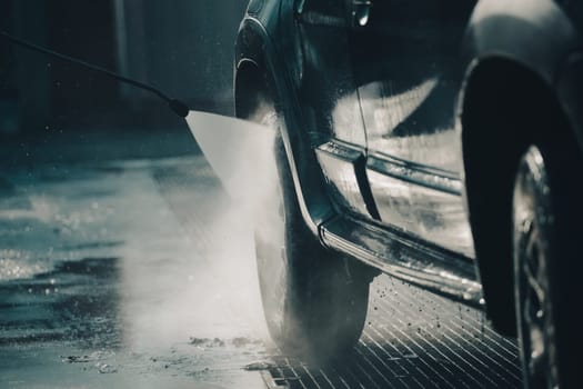Car wash with pressurized water in car wash outside.