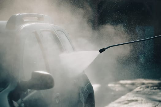 Car wash with pressurized water in car wash outside.