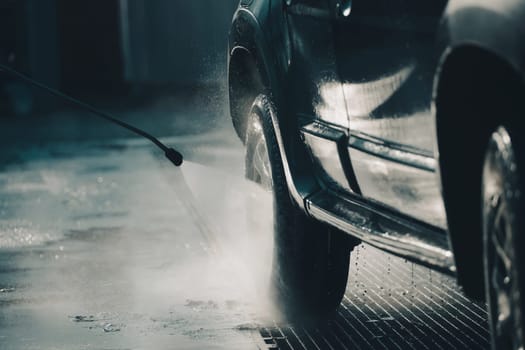 Car wash with pressurized water in car wash outside.