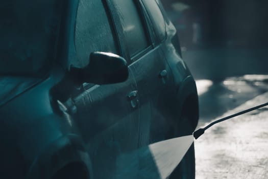 Car wash with pressurized water in car wash outside.