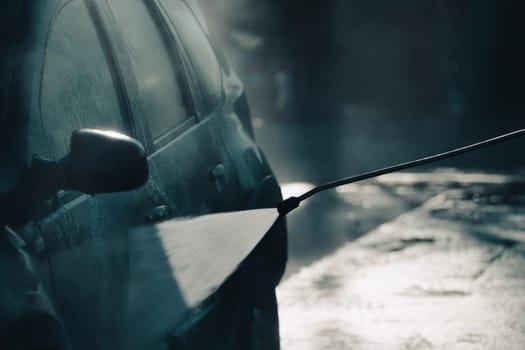 Car wash with pressurized water in car wash outside.