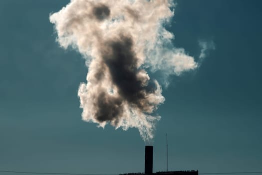 Air pollution from power plant chimneys. Industry and global warming concept