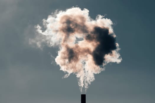 Air pollution from power plant chimneys. Industry and global warming concept