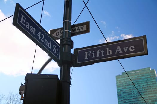 Blue East 42nd Street and Fifth Avenue historic sign in midtown Manhattan in New York