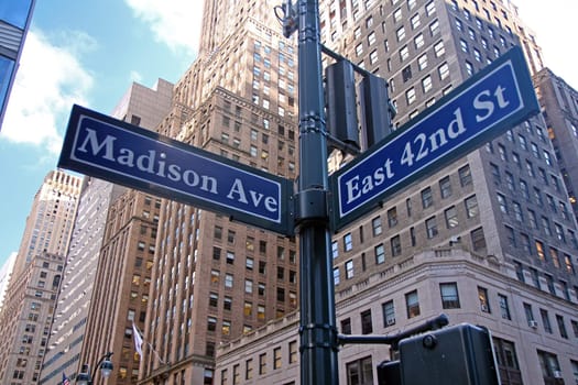 Blue East 42nd Street and Madison Avenue historic sign in midtown Manhattan in New York