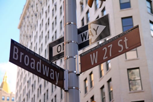 Brown West 27th Street and Broadway historic sign in Midtown Manhattan in New York City