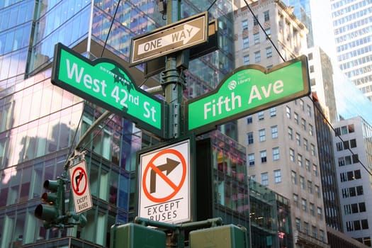 Green West 42nd Street and Fifth Avenue 5th Bryant Park traditional sign in Midtown Manhattan in New York City