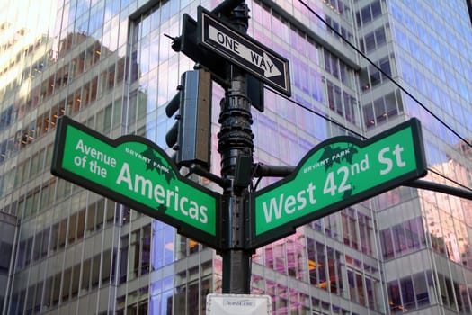 Green West 42nd Street and Avenue of the Americas 6th Bryant Park traditional sign in Midtown Manhattan in New York City