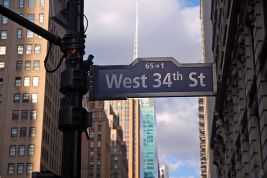 Blue West 34th Street on Broadway and Avenue of the Americas historic sign in Midtown Manhattan in New York City