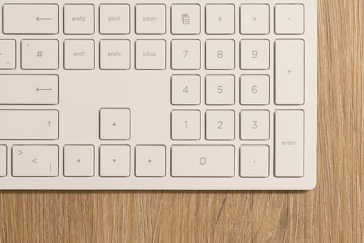 Keyboard from a computer and a computer mouse on a desk in the office
