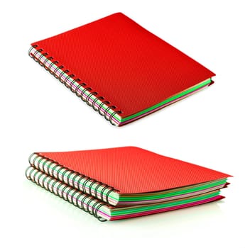 red diary spiral notebookes isolated on white background