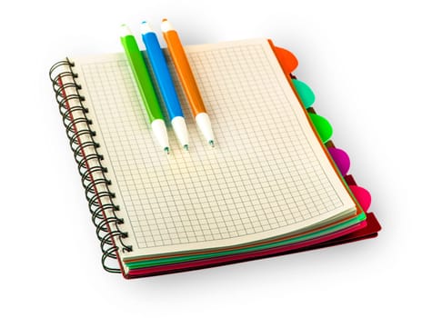 The red Diary notebook and colored pens isolated on white background.
