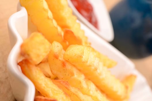Close up of pommes frites in a white bowl