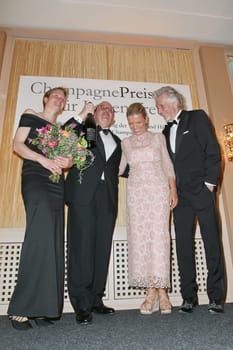 Denis Scheck (literary critic and prize-winner) with wife Christina Schenk and laudator Frank Schaetzing and wife Sabina Valkieser-Schaetzing,awarding of the Champagne Prize for Joie de vivre at the Hotel Louis C. Jacob,Hamburg,27.04.2015