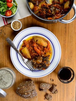 beef dish with carrots on the old table