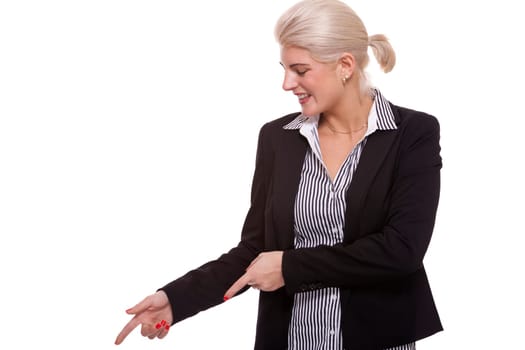 Young woman in business clothes shows with both arms in one direction isolated on white background