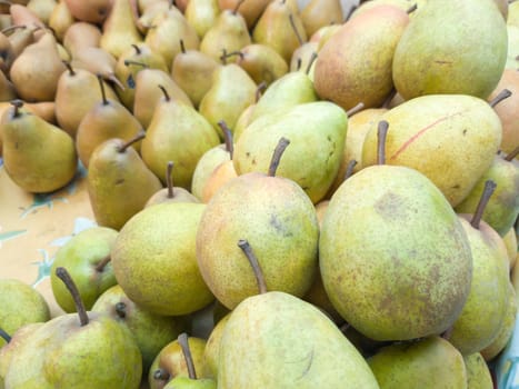 Fresh fruits in small boxes for sale on the farm, pears with stems. Pears at the farmers market, food market, fruit stand.
