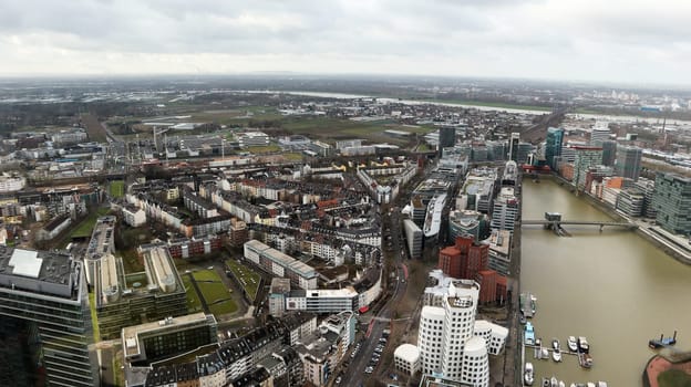 Dusseldorf, Germany - February 20, 2020. Scenic view of the city of Dusseldorf, the embankment of the river and the Rhine. Aerial view of a European city in Germany. Aerial view of a drone. Panorama