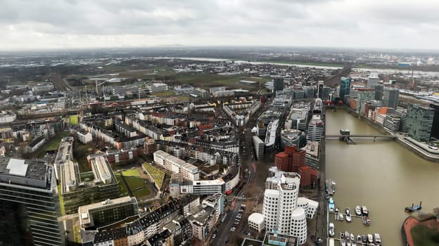 Dusseldorf, Germany - February 20, 2020. Scenic view of the city of Dusseldorf, the embankment of the river and the Rhine. Aerial view of a European city in Germany. Aerial view of a drone. Panorama