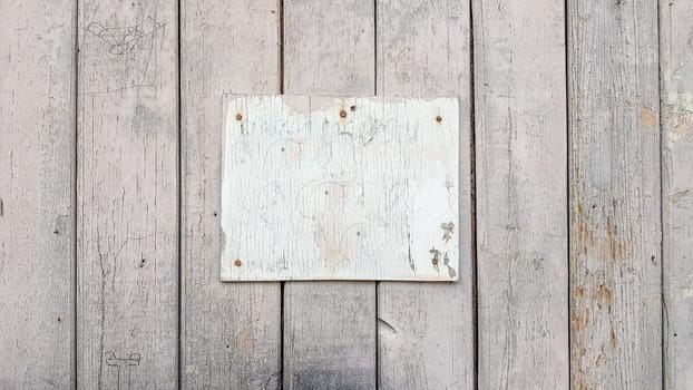 Sign boards on a rustic wooden wall mockup. vintage frames on an old wooden wall. Gray wooden background texture with copy space. wall wood table