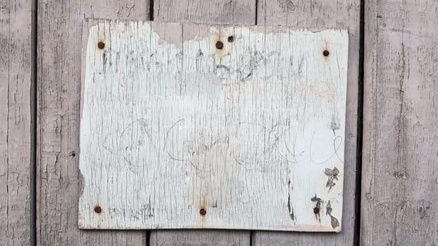 Sign boards on a rustic wooden wall mockup. vintage frames on an old wooden wall. Gray wooden background texture with copy space. wall wood table