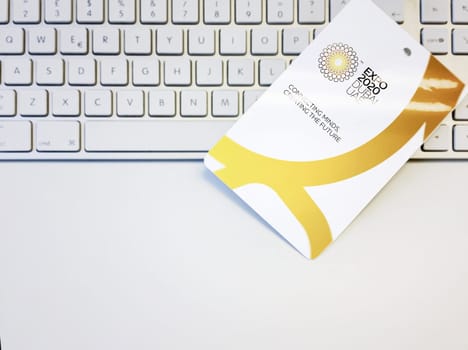 Dubai, UAE, October 2021:Blank white badge with the Dubai Expo 2020 logo on a computer keyboard. International event originally scheduled for 2020 postponed until 2022 due to the COVID-19 pandemic