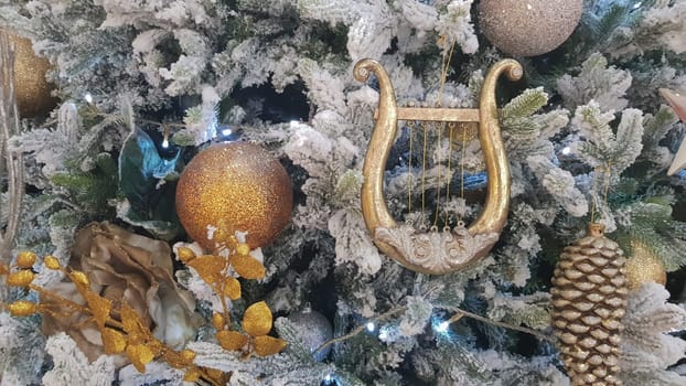 Close-up of a Christmas background. Celebration. Christmas tree with toys and decorative snow for a happy new year. Christmas decorations, New Year's atmosphere. Beautiful modern postcard
