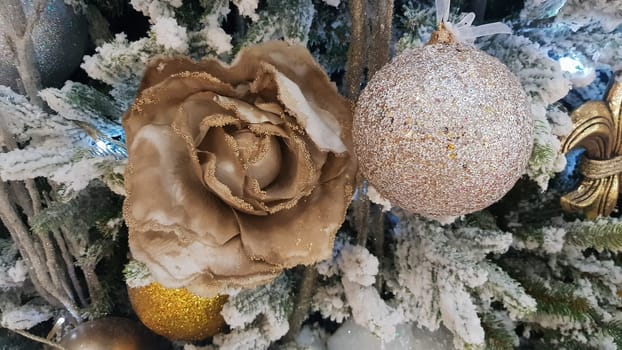 Close-up of a Christmas background. Celebration. Christmas tree with toys and decorative snow for a happy new year. Christmas decorations, New Year's atmosphere. Beautiful modern postcard