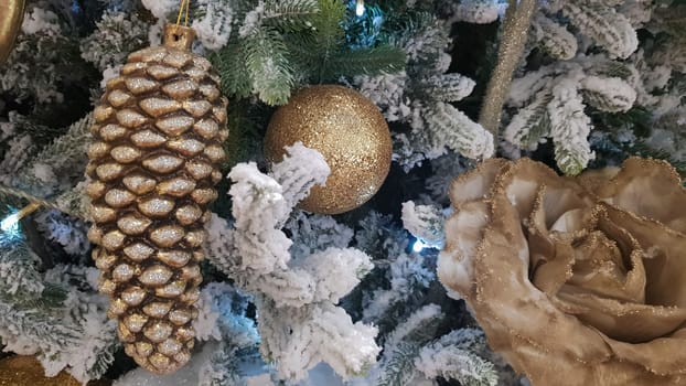 Close-up of a Christmas background. Celebration. Christmas tree with toys and decorative snow for a happy new year. Christmas decorations, New Year's atmosphere. Beautiful modern postcard