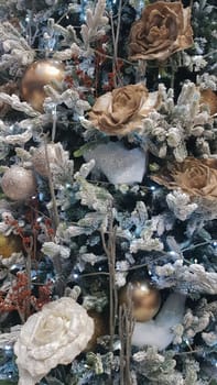 Close-up of a Christmas background. Celebration. Christmas tree with toys and decorative snow for a happy new year. Christmas decorations, New Year's atmosphere. Beautiful modern postcard