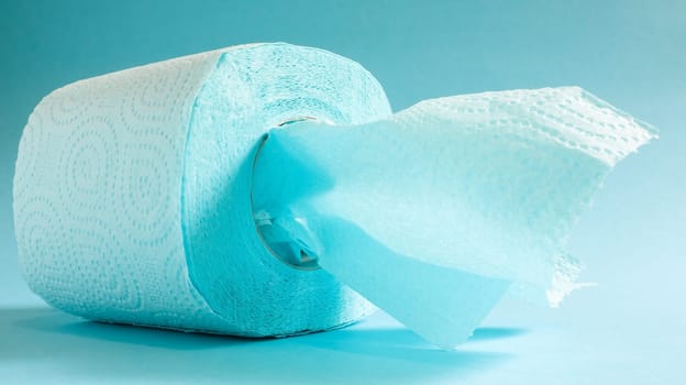 Blue roll of modern toilet paper on a blue background. A paper product on a cardboard sleeve, used for sanitary purposes from cellulose with cutouts for easy tearing. Embossed drawing.