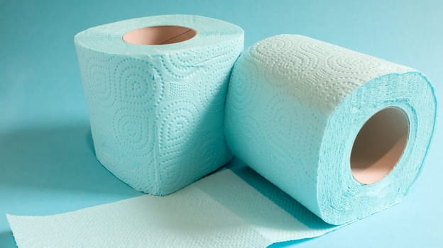 Blue roll of modern toilet paper on a blue background. A paper product on a cardboard sleeve, used for sanitary purposes from cellulose with cutouts for easy tearing. Embossed drawing.