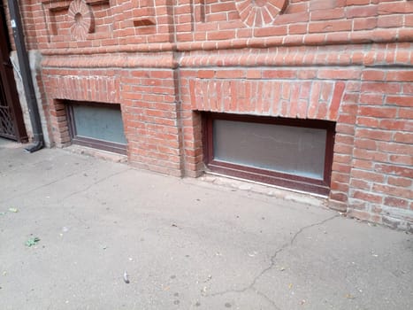 The upper part of the window of the ground floor of the building. Recessed windows of ancient buildings of the 19th century.