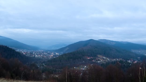 Colorful autumn landscape in a mountain village. Misty morning in the Carpathians. Ukraine, Europe. Beautiful hills and houses. World of beauty. Mountain view in the fall. Beautiful natural landscape
